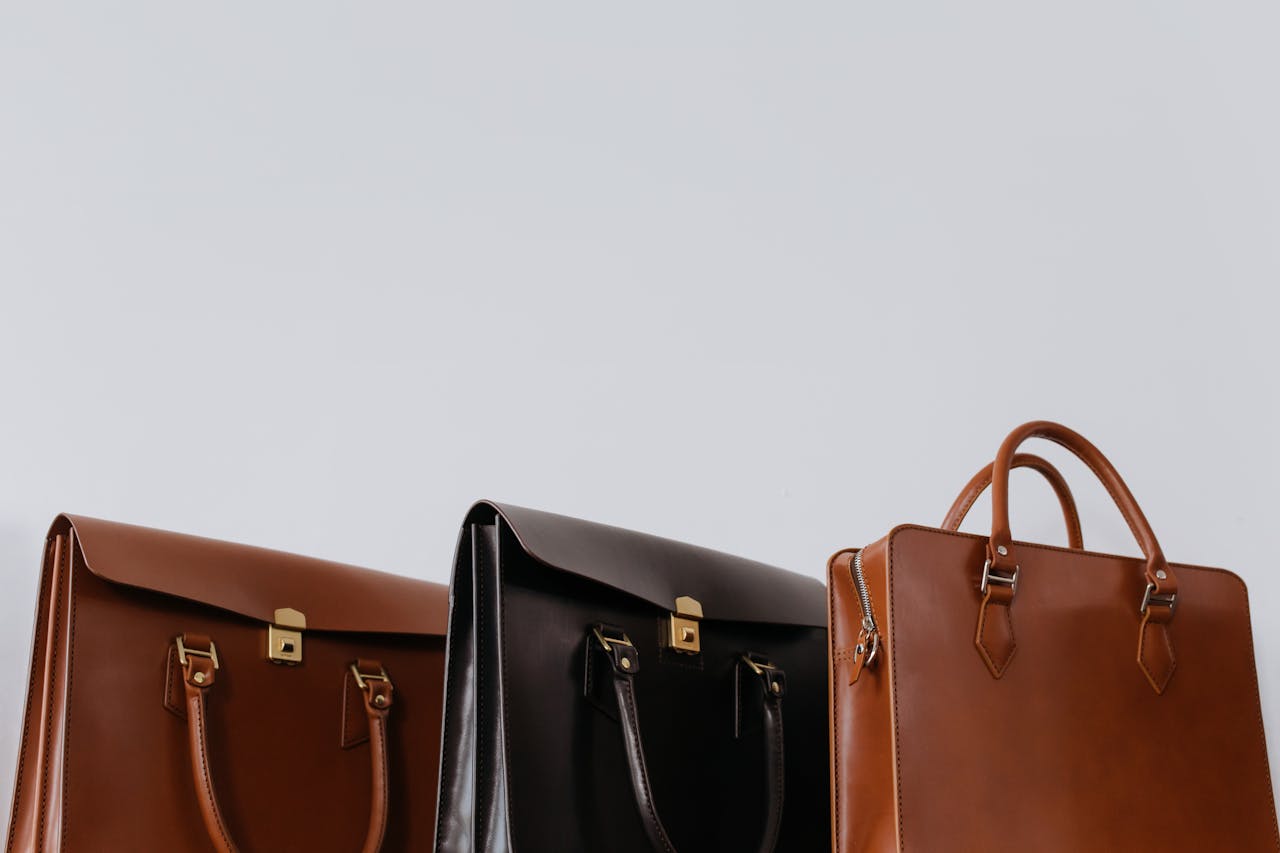Brown And Black Leather Bags In Close Up Photography 6650001